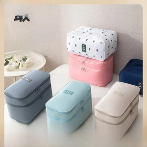 Detailed view of an eight-piece travel organizer set in various colors and floral patterns