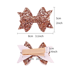 Glitter bow hair clip with sequins, 8cm width dimensions shown on white background