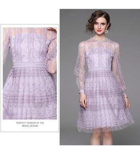 Detail of lavender lace embroidery and mesh stitching on long-sleeve midi dress
