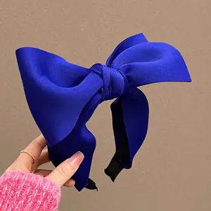 Classic Klein Blue satin oversized bow headband with a high-profile elegant design