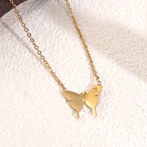 Minimalist gold butterfly necklace with delicate chain and custom R letter engraving