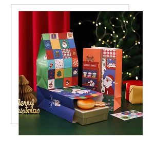 Detailed close-up of festive Christmas paper gift bags with Santa and reindeer patterns