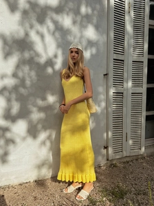Fashionable yellow knitted slim-fit maxi dress with chic ruffle hem and spaghetti straps