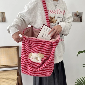 Detail of pink and red striped plush tote bag with a cute cartoon dog embroidery patch