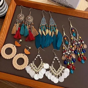 Bohemian tassel and feather earring set in ethnic style with woven beaded details