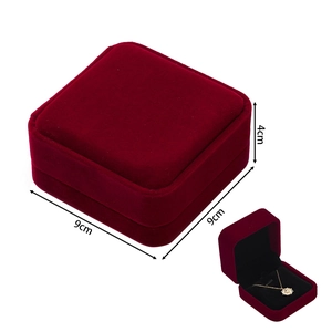 Macro view of 9x9x4cm burgundy velvet necklace jewelry box with black interior lining