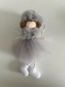 Detail of plush angel Christmas ornament with tulle skirt and knitted hat for tree decor
