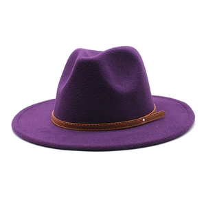 Detail of purple wool felt fedora featuring a slim brown leather belt with metal stud
