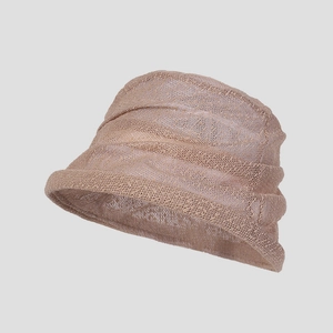 Close-up of lightweight lace hollow knit cloche hat in light coffee color with ruffles