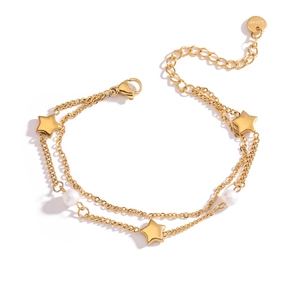 Detail of double-layer gold plated stainless steel bracelet with star and pearl charms