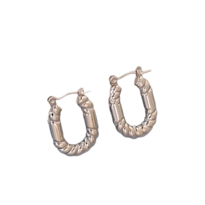 Minimalist silver irregular geometric twisted hoop earrings in polished stainless steel