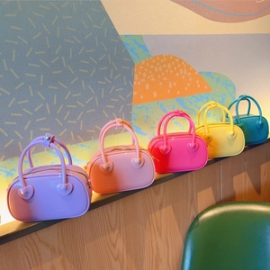 Colorful PVC jelly mini crossbody bags with heart patches in five vibrant candy colors