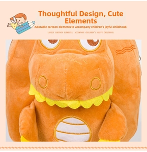 Close-up of soft orange plush dinosaur backpack showing textured coral fleece material