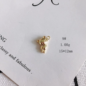 Detailed macro view of a 15x12mm golden bear hollow charm with 1.00g weight specs