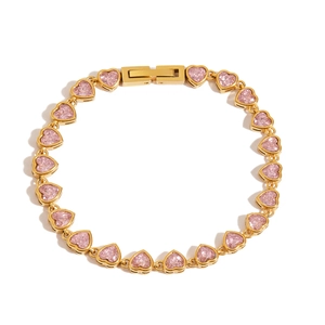 Close-up of pink heart-shaped crystals on a gold-plated stainless steel bracelet