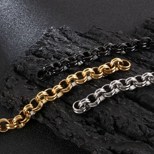 Macro view of heavy duty punk style O-ring chains in black, gold, and silver finishes