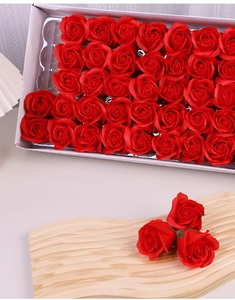 Detailed view of artificial red soap flower roses in a premium gift box set