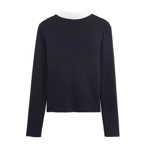 Slim fit black ribbed knit top with contrasting white polo collar and long sleeves