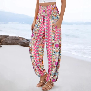 Bohemian high-waist floral harem pants with vibrant pink ethnic patterns and elastic cuffs