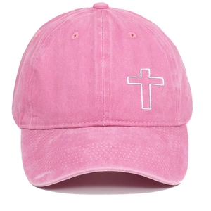 Detail of pink washed cotton baseball cap with white embroidered cross and vintage finish