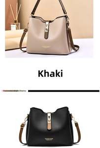 Detail view of khaki and black bucket bags showing vertical trim and metal buckles