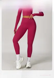 Detail view of rose red high-waisted yoga pants with model size and height parameters