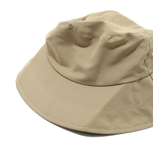 Close-up of khaki ripstop fabric and reinforced stitching on outdoor sun hat brim