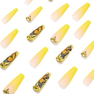 Yellow gradient coffin press-on nails with butterfly patterns and rhinestone accents