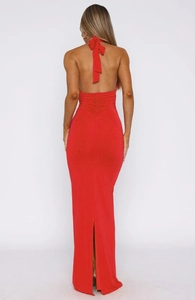 Detailed back view of red backless maxi dress with halter tie and pleated waist detailing