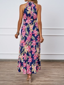Detail of elegant backless halter floral dress with pleated fabric in navy blue