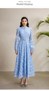 Detail of light blue lace dress featuring stand collar, lantern sleeves and belted waistline