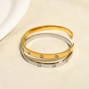Classic geometric stainless steel bangles in gold and silver with zircon crystal accents