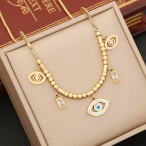 Gold evil eye necklace with turquoise square stones on snake chain in jewelry box