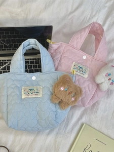 Quilted heart pattern tote bag with teddy bear charm in light blue and pink colors