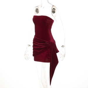 Detail of burgundy velvet strapless mini dress featuring side drape and knot detail