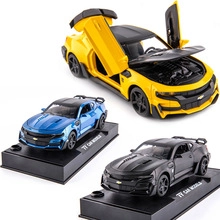 Detailed trio of vintage alloy car models in yellow, blue and black with open hoods