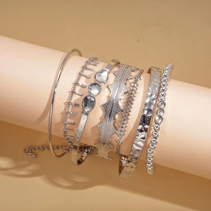 Detail view of silver 6-piece geometric bracelet set featuring rhinestones and varied textures