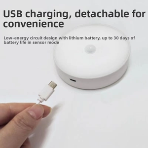 Detail of USB charging port on white circular night light with long battery life