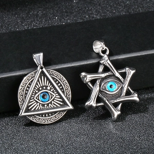 Detail of gothic stainless steel triangle and hexagram pendants with blue evil eye accents