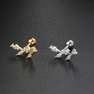 Leaf shaped piercing earrings with zircon insets in gold and silver finish