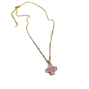 Elegant gold titanium steel necklace with pink clover pendant featuring micro-set crystals