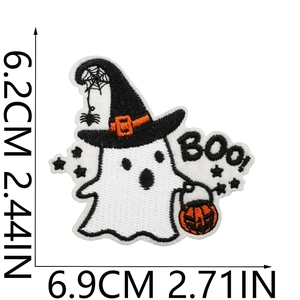 Macro view of Halloween ghost embroidery patch with orange pumpkin and witch hat detail