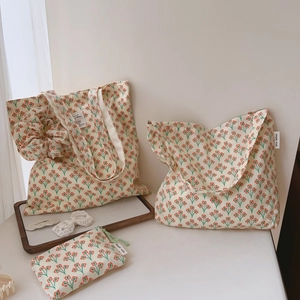 Detail of vintage orange floral cotton tote bags with matching small drawstring pouch