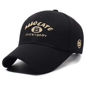Classic black cotton baseball cap featuring gold embroidered letters and curved brim style
