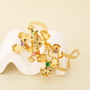 Detailed close-up of double-layer stainless steel flower cuff with colorful crystals