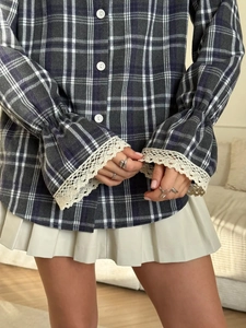 Plaid long-sleeve shirt with beige lace-trimmed flared cuffs and pleated mini skirt