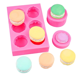 Pink silicone macaron molds for chocolate fondant and colorful dessert baking sets