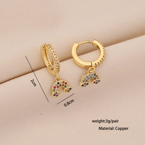 Detail shot of gold rainbow earrings with colored cubic zirconia and 2cm size specs