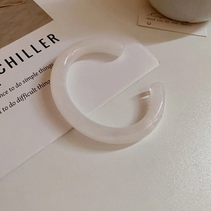 Minimalist white marbled acrylic open cuff bracelet in a trendy C-shaped geometric design