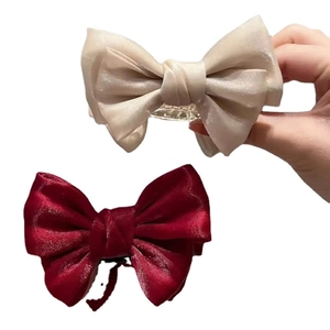 Elegant satin bow hair claw clips in champagne and burgundy for stylish bun hairstyles